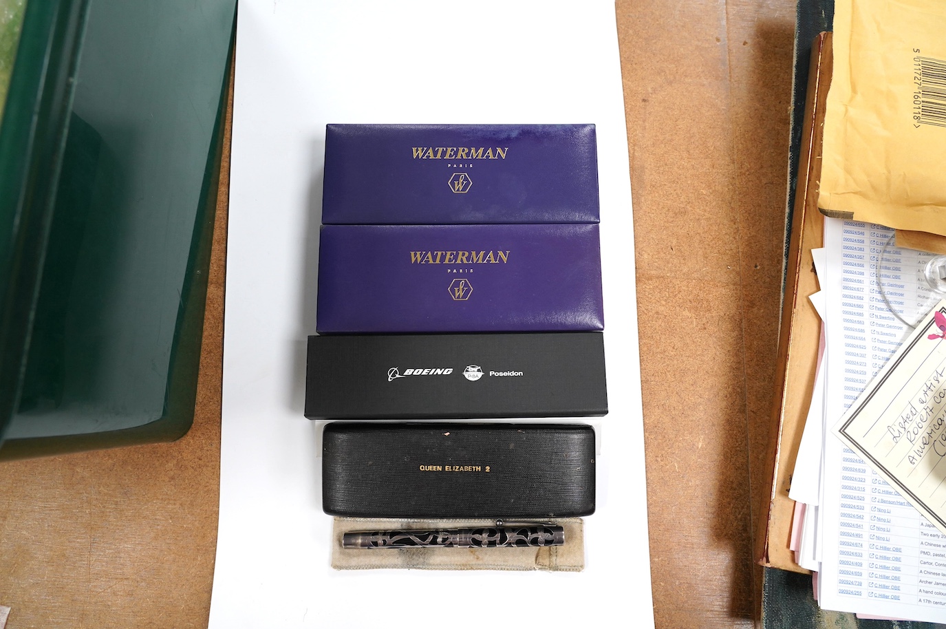 A silver mounted Sheaffer fountain pen, two cased Waterman fountain pens, a ballpoint pen branded for Boeing, and a Queen Elizabeth II pen and cufflink set. Condition - fair to good